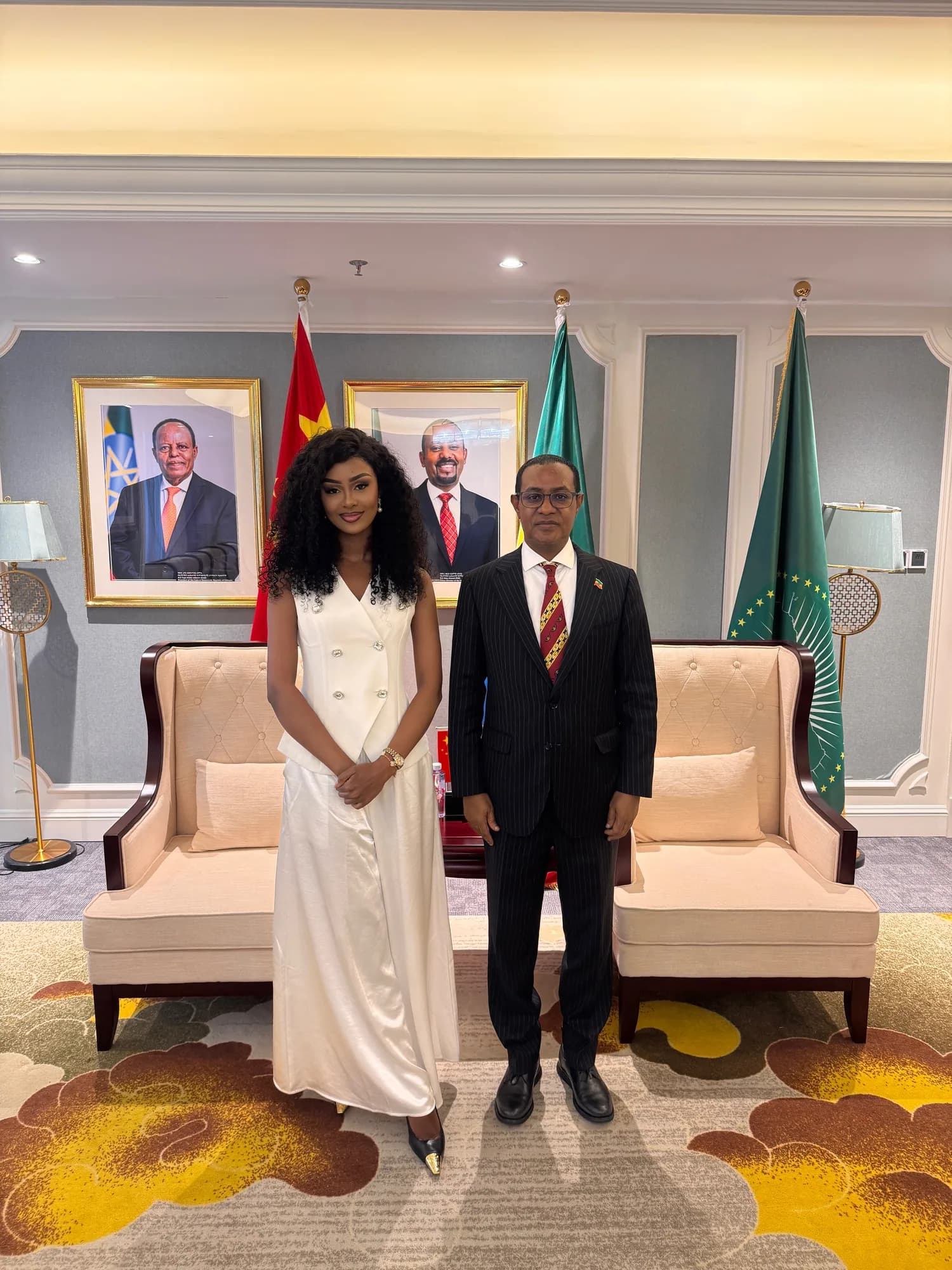 Birara founder with an international representative beside African Union flags